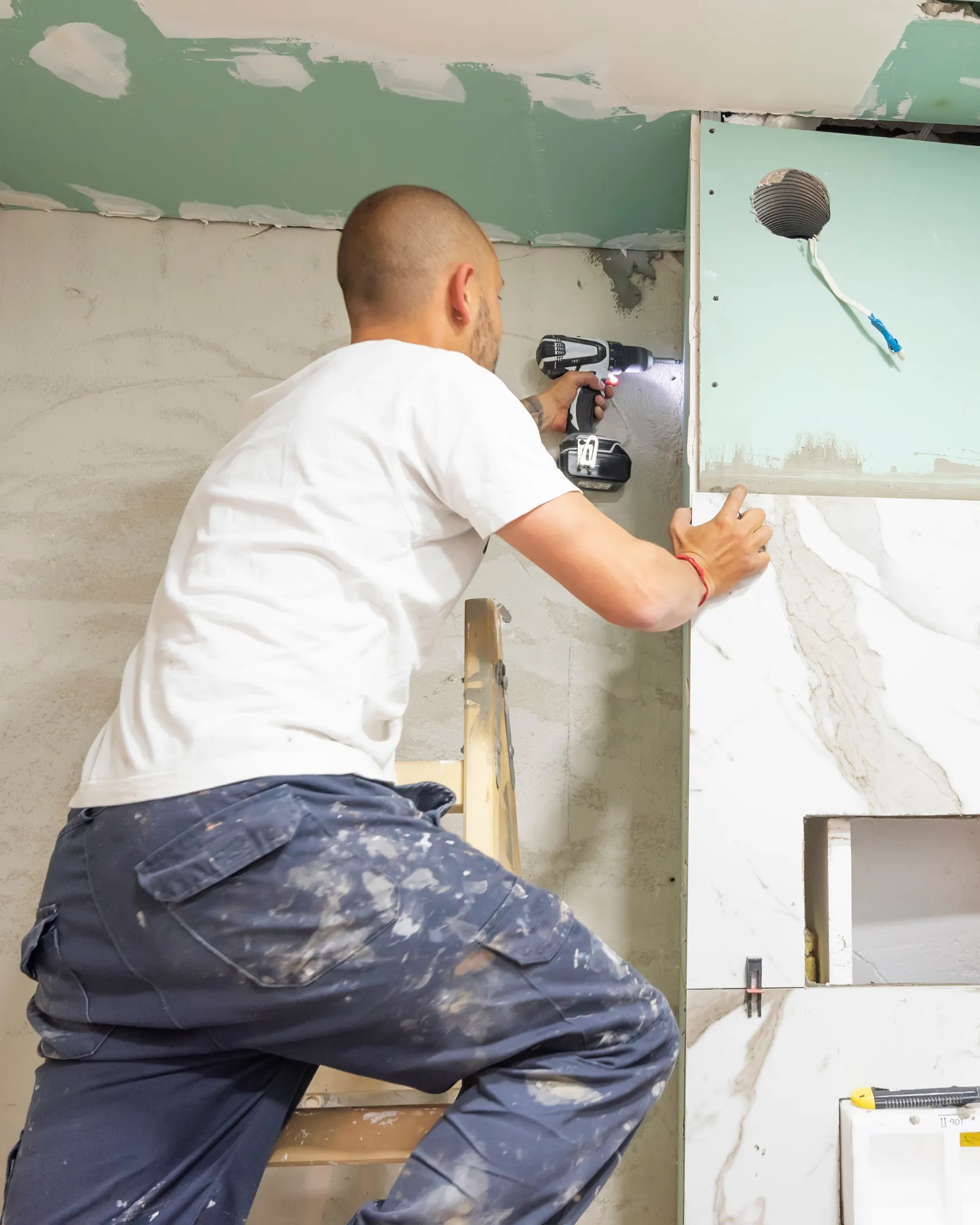 Dream Remodel LA contractor installing modern bathroom panel in Los Angeles