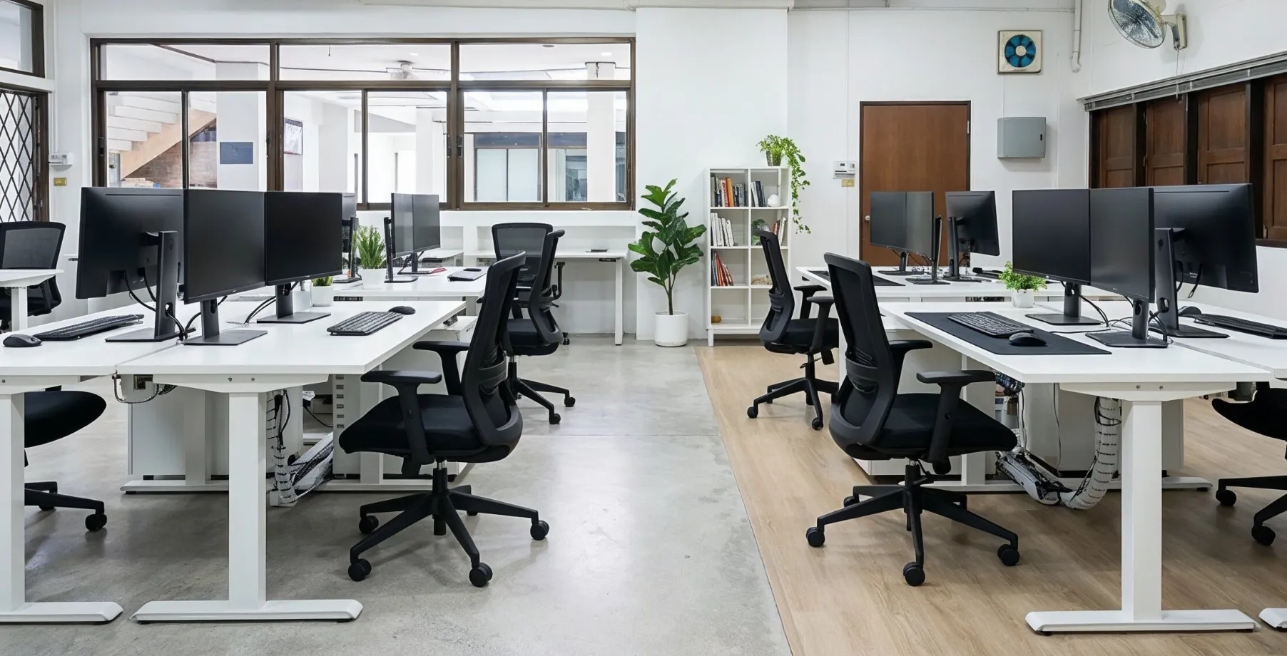 Modern commercial office remodeling in Los Angeles with clean desks and open workspace