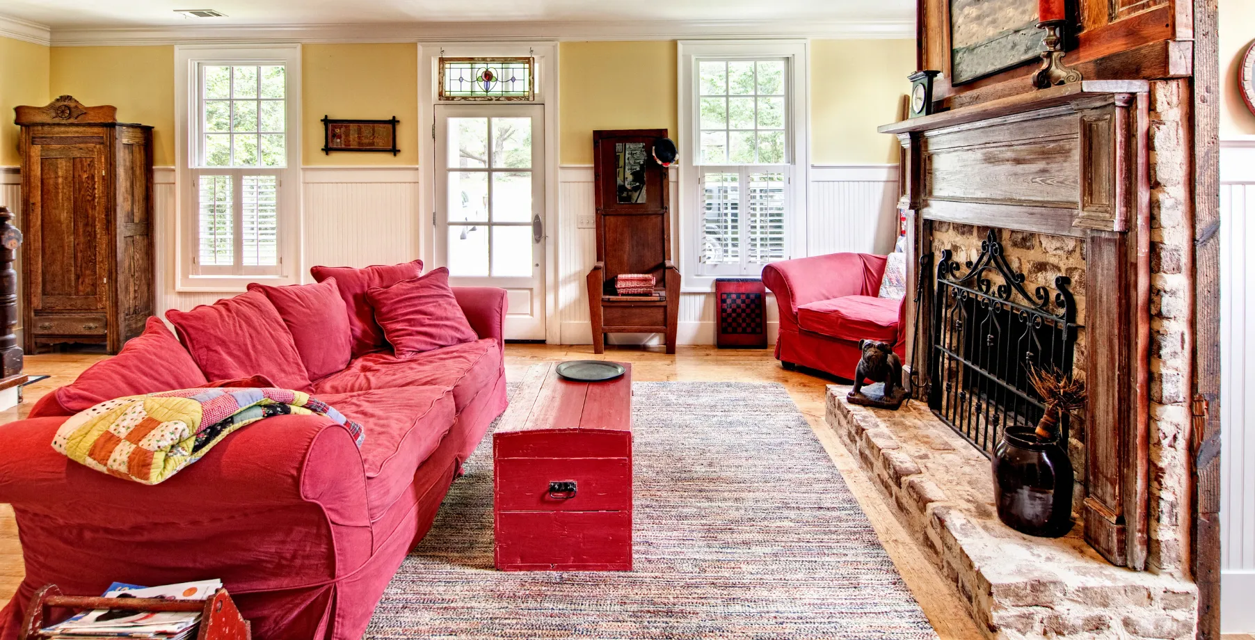 Traditional outdated living room in Los Angeles home before remodeling with worn furniture and old finishes