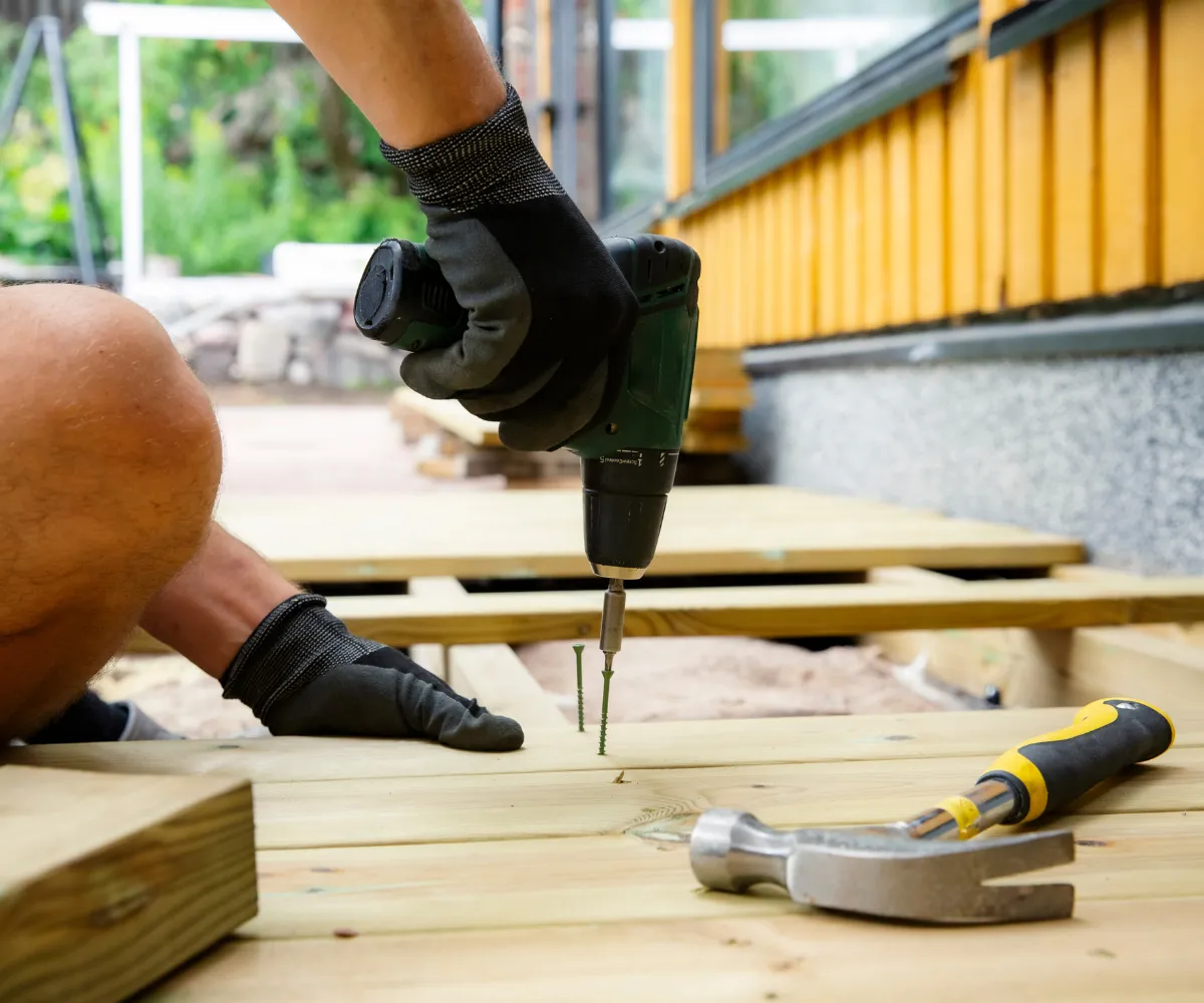 Outdoor living and backyard remodeling in Los Angeles with deck construction and wood installation using power tools